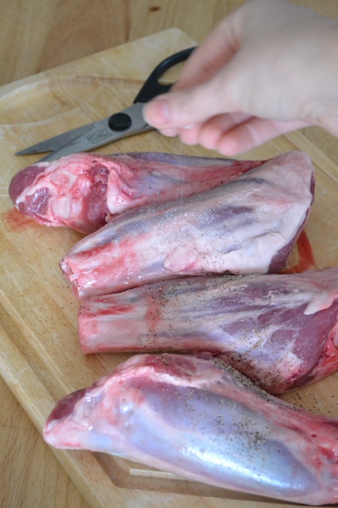 Season the lamb shanks