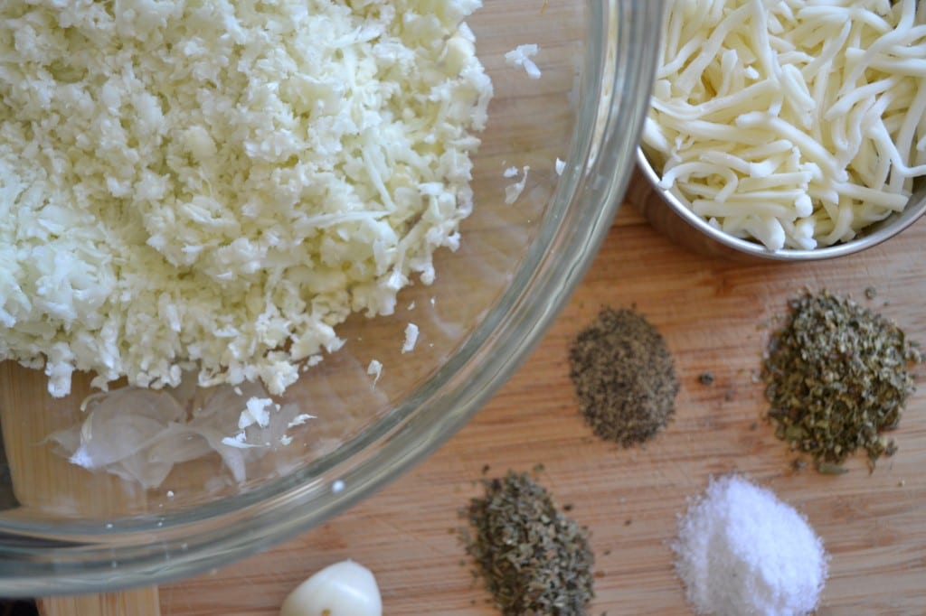 A display of needed ingredients to make Cauliflower Crusted Pizza