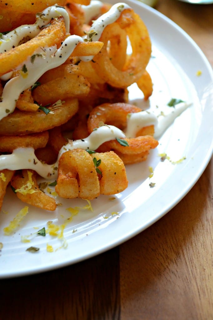 Greek Curly Fries topped with herbs and whipped feta  sarcastic cooking