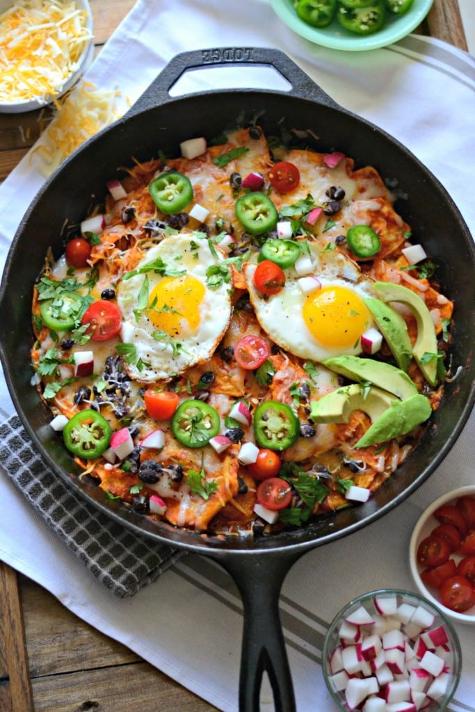 Chipotle Chilaquiles | Sarcastic Cooking Crispy Tortilla Chips coated in homemade chipotle red sauce and topped with beans and cheese.