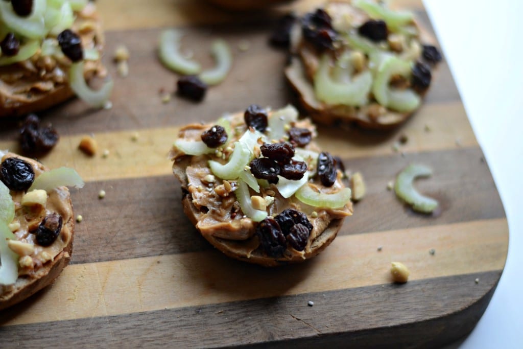 Ants on a Log Snack Bagel (with chopped peanyus, hemp, chia, and flax seeds) | Sarcastic Cooking