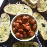 Roasted Tomatoes in Garlic Olive Oil with Pesto Crostini