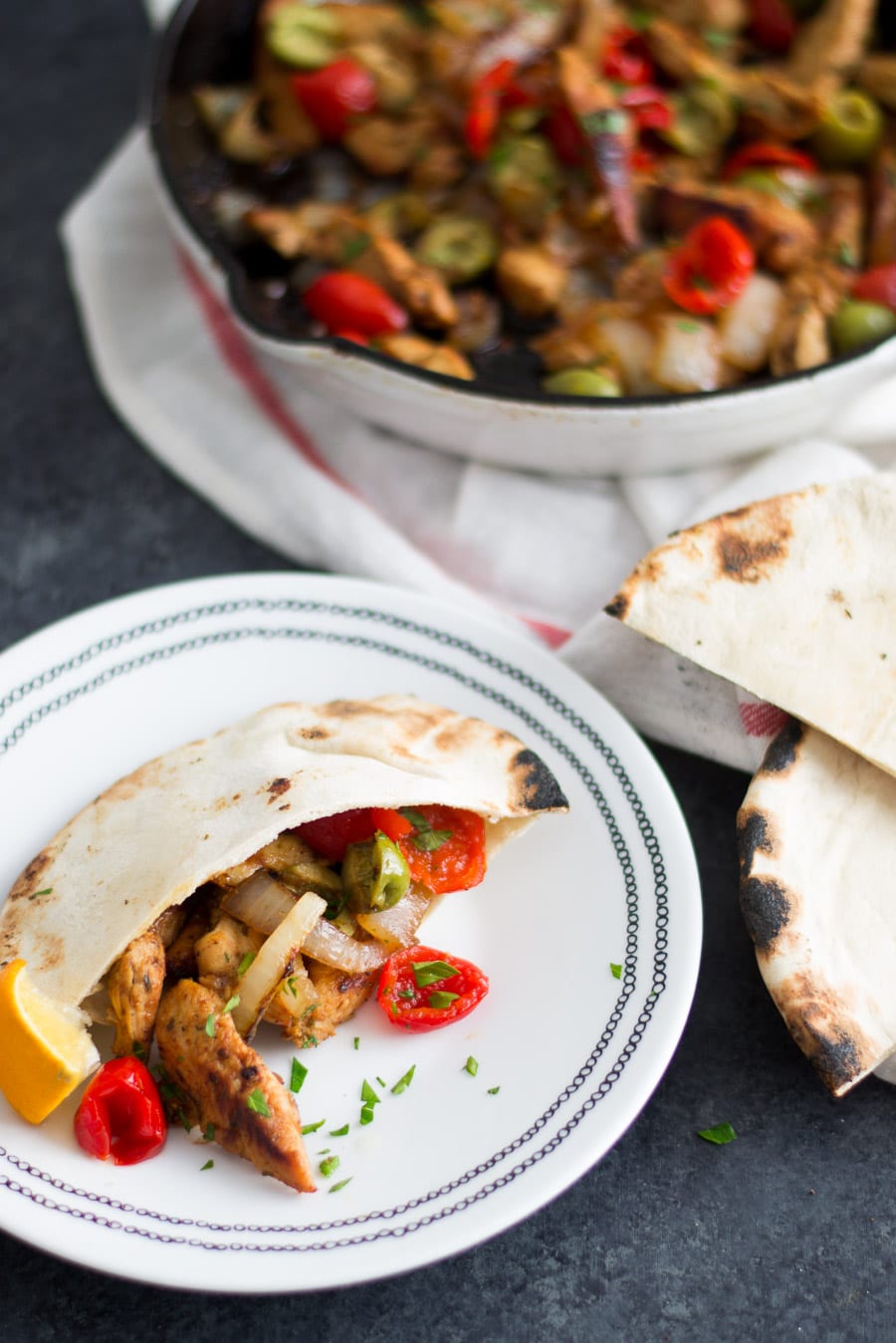 Greek Skillet Chicken with peppers, onion, and olives on pita bread | Sarcastic Cooking